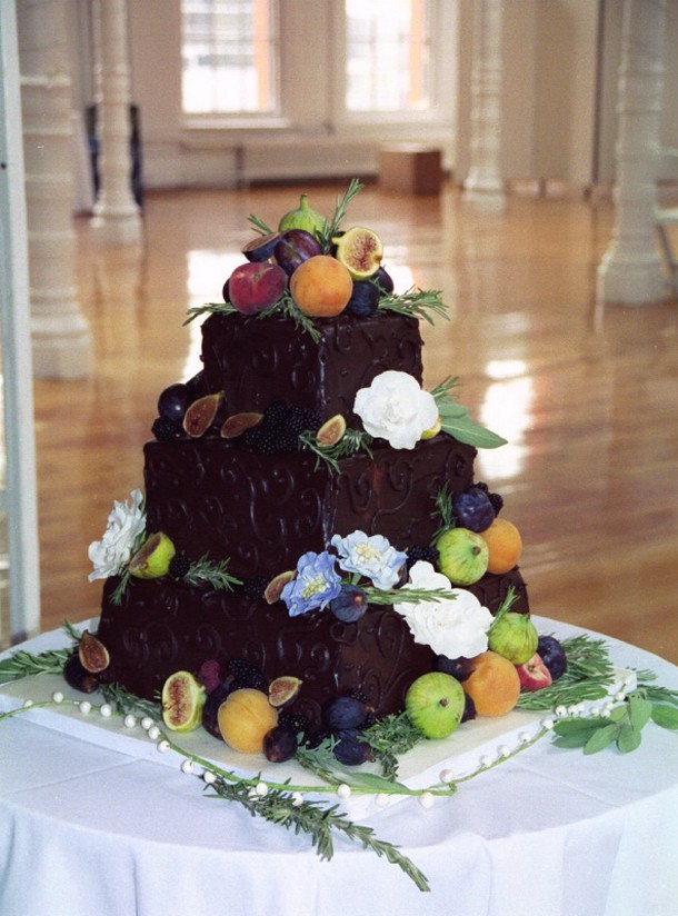 chocolate wedding cake with flowers and fruits