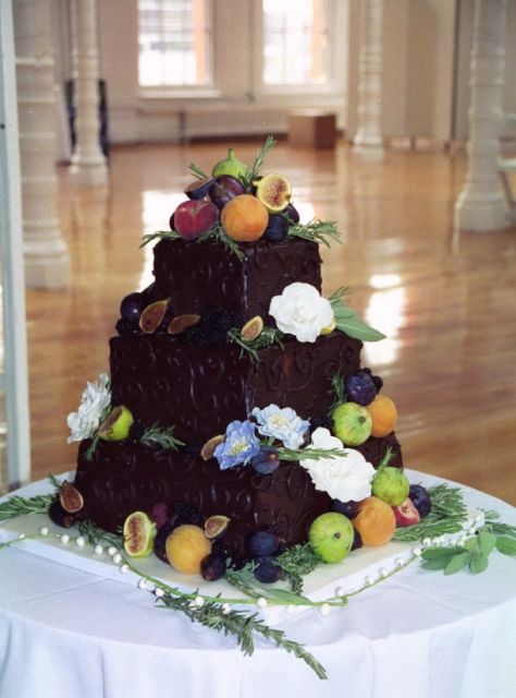 chocolate wedding cake with flowers and fruits