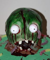 Zoombie cake with big eyes and worms coming out from the zoombie head.JPG
