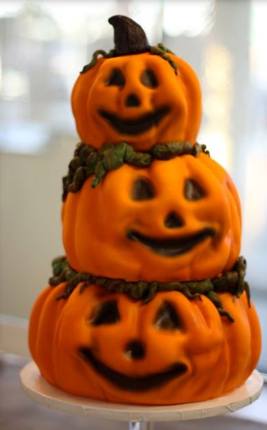 Three tiers pumpkin cakes in orange.JPG