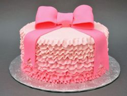 Unique Pink Ruffled Cake with Large Bowtie.JPG
