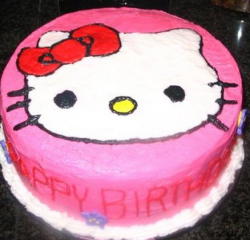Hot pink hello kitty cake with hello kitty face cake decoration.PNG