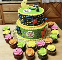 Pacman theme 50th Birthday Cake with accompanying cupcakes.JPG