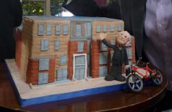 Retirement Cake with Realistic Depiction of Retiree next to Company Building and Bike.JPG