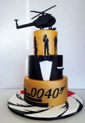 James Bond 3 tier Cake with Tuxedo Middle Layer, Silouettes and Helicopter on top.JPG
