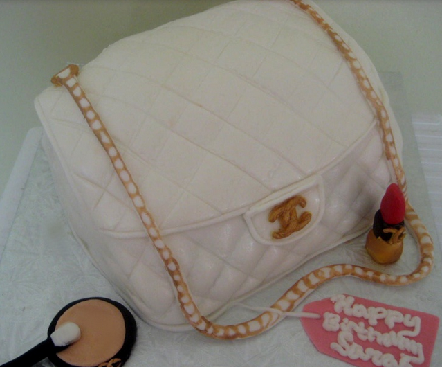 White Chanel handbag with gold chain strap with makeup birthday cake.PNG