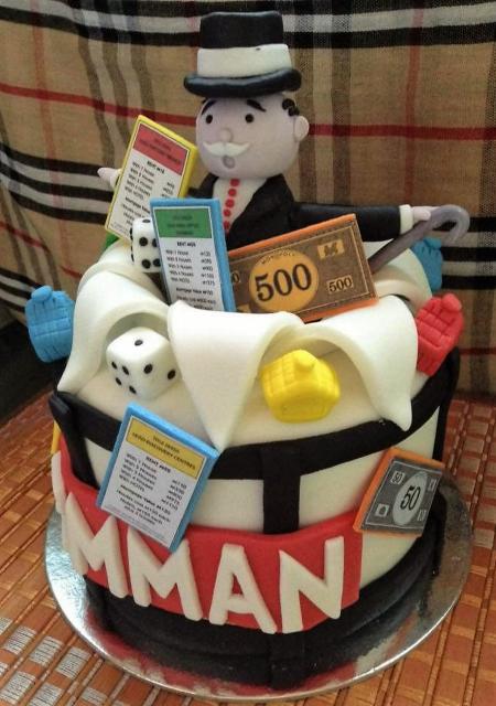 Monopoly theme Cake with Cards Money and Man in Top Hat.JPG