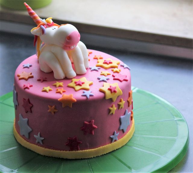 Pink Cake with Cute Unicorn Topper