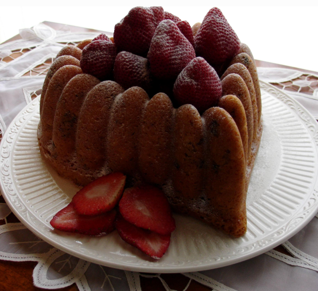 Heart shaped valentine cake with fresh strawberries topper.PNG