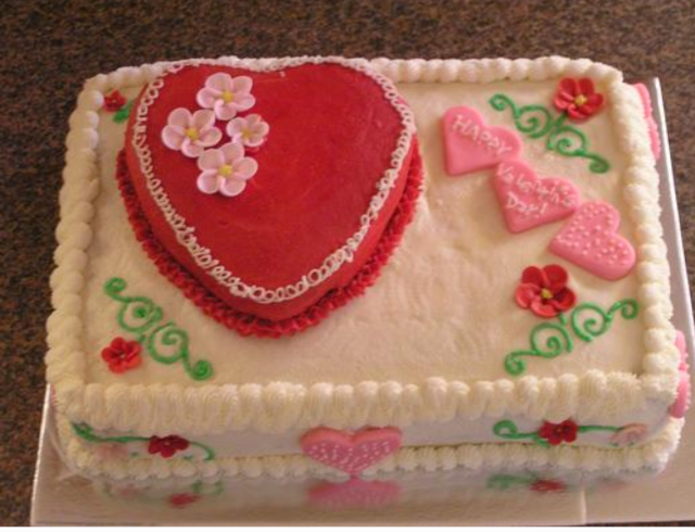 Picture of big Valentine cake with heart decors.PNG