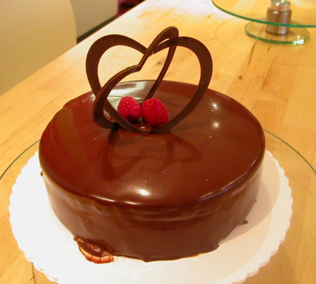 Rich chocolate valentine cake with chocolate heart shape topper.PNG