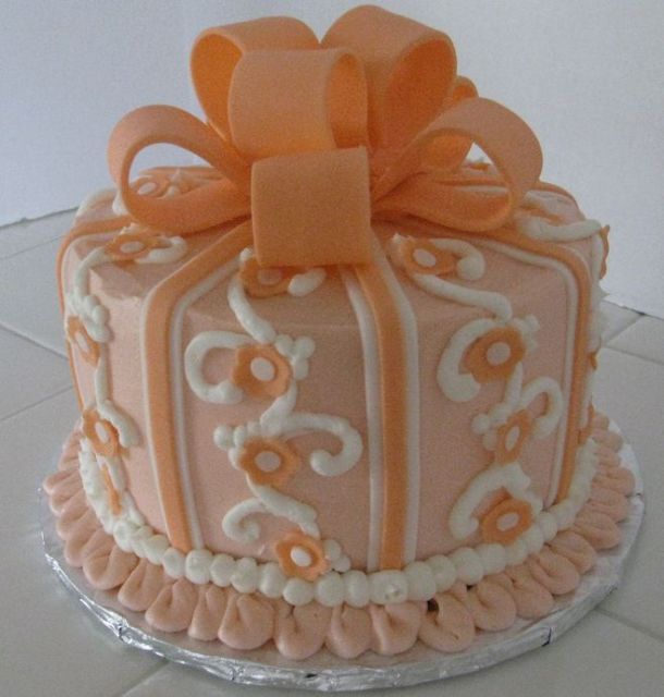 Lemon cake with pearls and orange bowtie.JPG