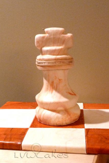 Cool chess piece birthday cake with chess board.JPG