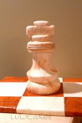 Cool chess piece birthday cake with chess board.JPG