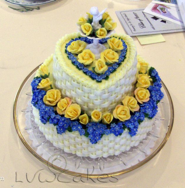 Elegant two tier white basket cake with small yellow roses.JPG