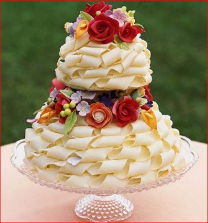 White chocolate ribbon wedding cake with roses.jpg