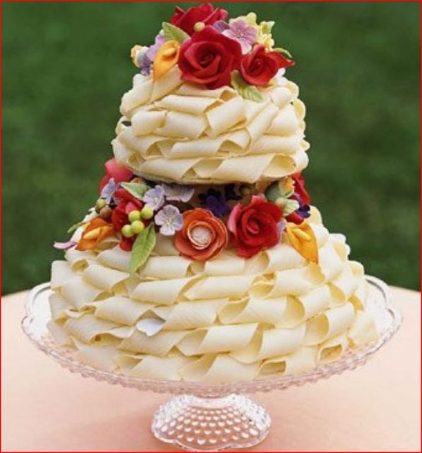 White chocolate ribbon wedding cake with roses.jpg