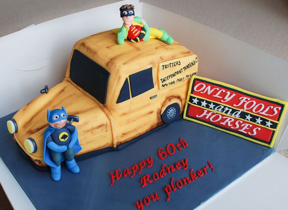 Humorous 60th birthday cake with Batman and Robin.JPG