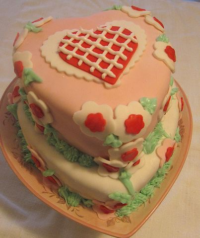 Two tier heart-shaped Valentine's cake in pink and white.JPG