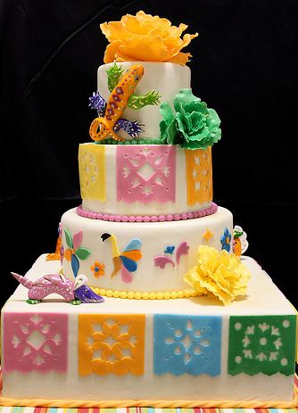 Nice four tier white cake with Mexico theme.JPG