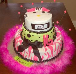 Three tier birthday cake with chocolate beads and bowtie and cat face on top for a girl.JPG