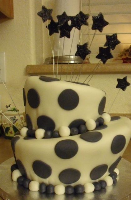 Two tier Black Pokadot topsy turvy cake.JPG