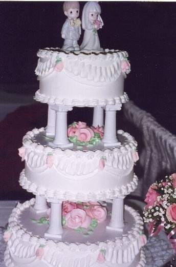 traditional wedding cake with pink flowers