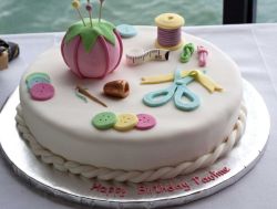 Ivory round white sewing theme birthday cake.JPG