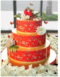 Red wedding cake with nature cake topper.PNG
