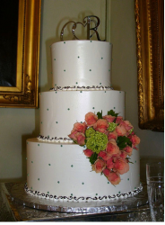 Wedding cake with initial wedding cake topper.PNG