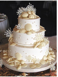 Wedding cake with white chocolae seashell cake topper.PNG