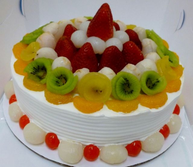 Fresh fruit white ice cream birthday cake strawberries kiwi lychee.JPG
