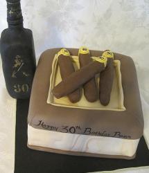 Cigar box with cigars and liquor bottle birthday cake.JPG