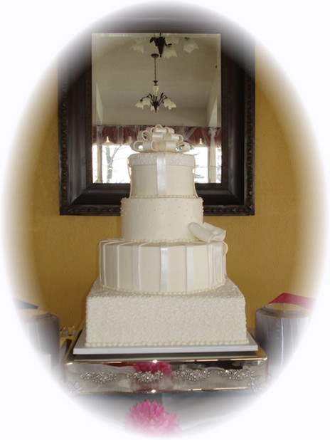 wedding cake with combination of sqaure and round tier in white