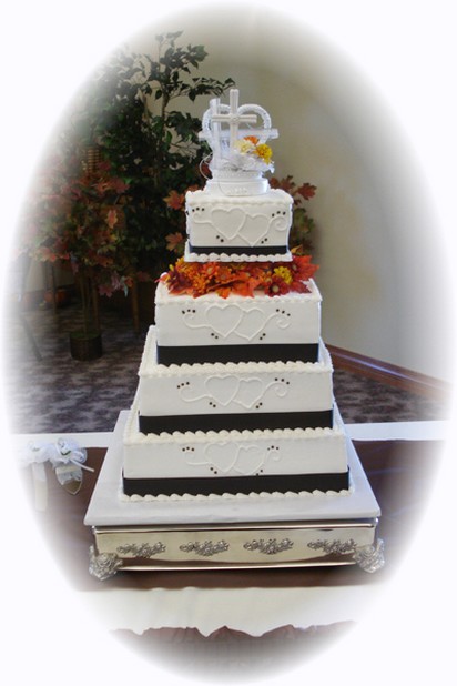 five tier wedding cake with cake top with flowers