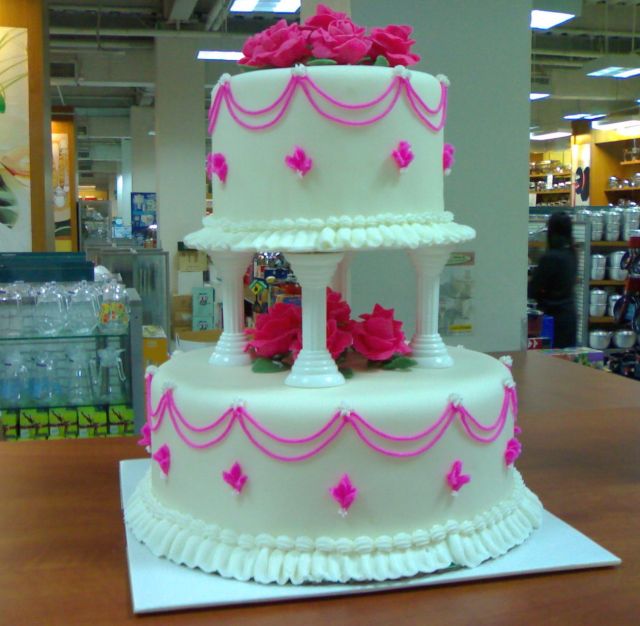 pink and white wedding cake with two tier