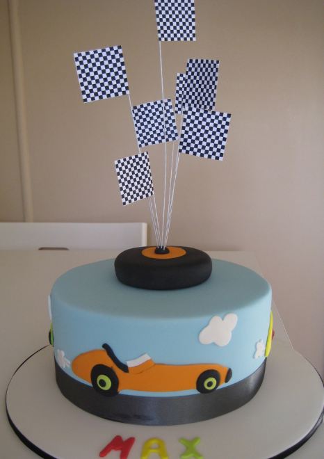 Car theme powder blue cake with checker flags.JPG