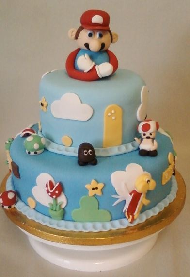Two tier light blue Super Mario cake.JPG