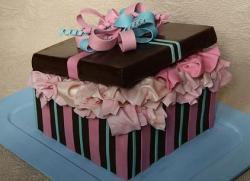 Brown and pink gift box cake with bow and tissue paper.JPG