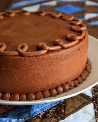 Chocolate cream birthday cake with chocolate swirl on top.JPG