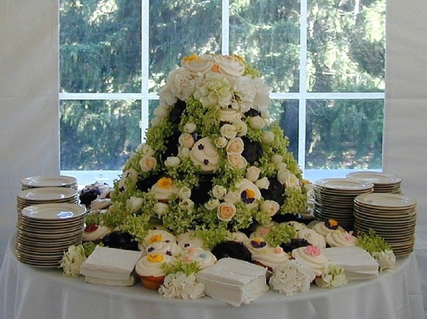 wedding cake with full of fresh flowers