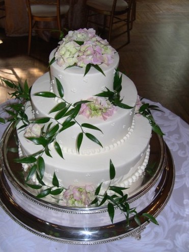 three wedding cake with fresh flowers