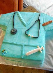 Nurse scrubs cake with stethescope and needle and bandage.JPG