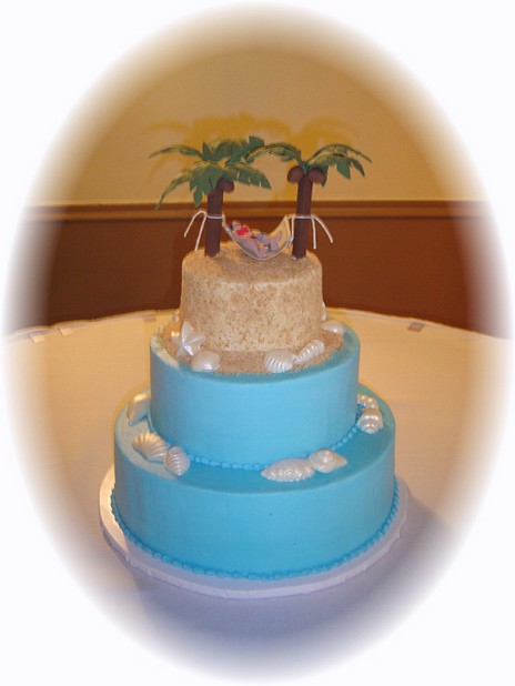 Island wedding cake in blue and cream color