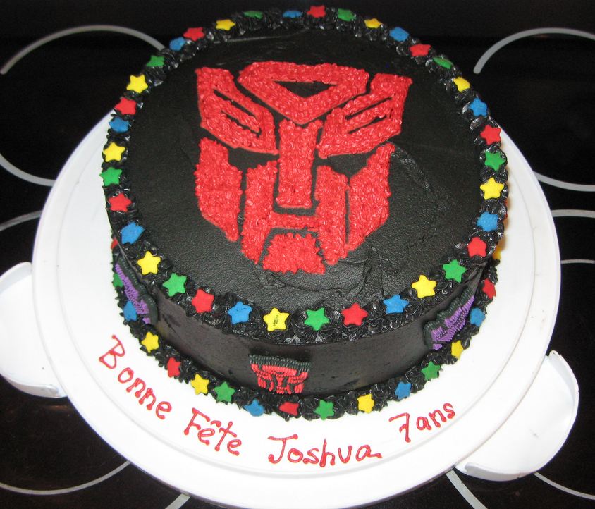 Transformers Autobots symbol dark chocolate cake.JPG