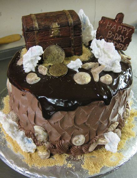 Treasure chest topper on chocolate cream birthday cake with sea shells.JPG