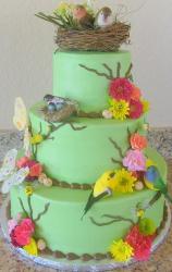 Three tier bird theme cake with bird's nest on top.JPG