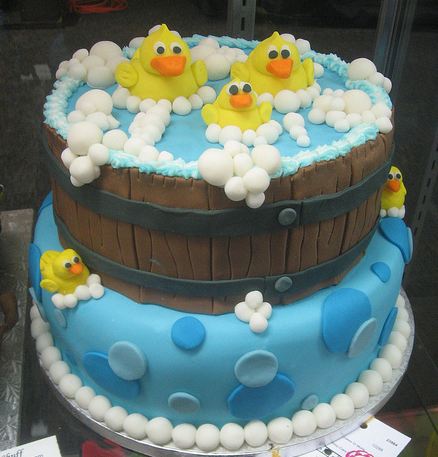 Two tier water barrel cake with ducks in a bubble bath.JPG