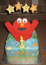 Elmo popping out of gift box birthday cake.JPG