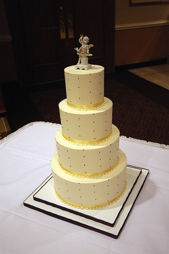 tall wedding cake in light yellow
